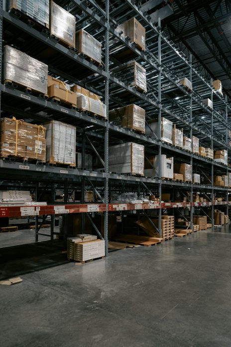 Distribution warehouse with stacked pallets — placeholder photo